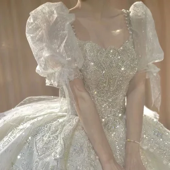 Prabangių Vestuvinių Suknelių Sluoksniuotos Rankovėmis Aikštėje Apykaklė Balta Duobute Crystal Bow Išsiuvinėtu Tiulio Kamuolys Blizgiu Princesė Vestuvių Suknelė Nauja